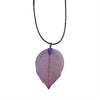A delicate iridescent bravery leaf necklace pendant with translucent purple and pink hues hangs from a black cord