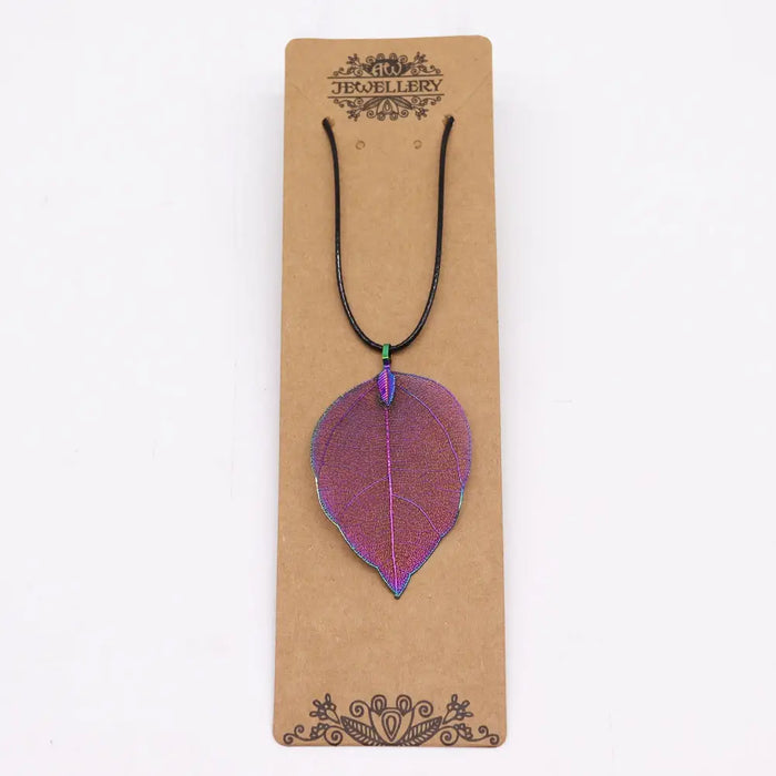 A multi coloured iridescent metal bravery leaf necklace pendant shaped like a leaf on a black cord