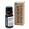 A small amber glass bottle with a black cap containing breathe easy essential oil blend of eucalyptus peppermint and ravensara