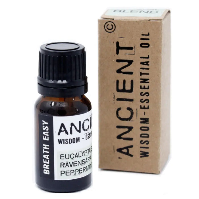 A small amber glass bottle with a black cap containing breathe easy essential oil blend of eucalyptus peppermint and ravensara