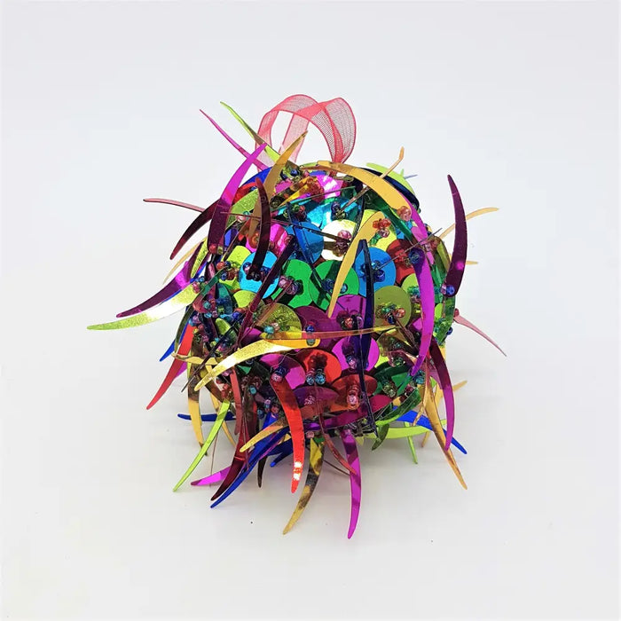A bright multi-coloured sequinned bauble with spiked sequins and metallic ribbons in small diameter spherical shape