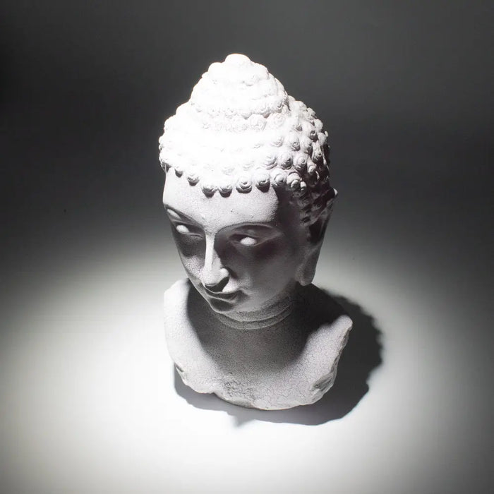 White stone buddha glow lamp bust with detailed curls and serene face featuring lavender crackle finish
