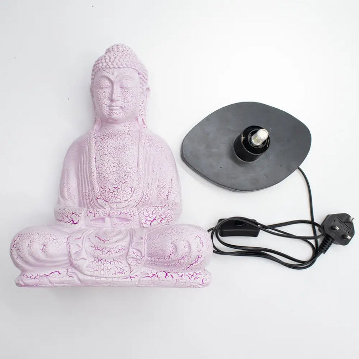 Pink buddha glow lamp with cherry crackle finish on black base and cord for meditation lighting