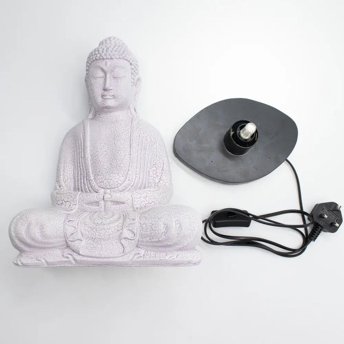 White cracked-finish buddha glow lamp with lavender crackle effect on black base and cord for meditation lighting