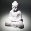 White stone buddha glow lamp with detailed robes and lavender crackle texture seated in a meditative pose