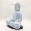 Sky blue cracked-finish buddha glow lamp in seated meditation pose on a black circular base