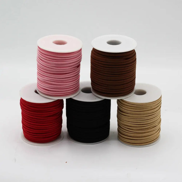 Five spools of bulk roll pendant cord in black pink brown red and tan faux suede material