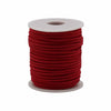 A bulk roll pendant cord in vibrant red faux suede neatly wound on a white plastic core spool