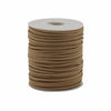 A bulk roll pendant cord of tan faux suede neatly wound on a white plastic core showing the suede texture