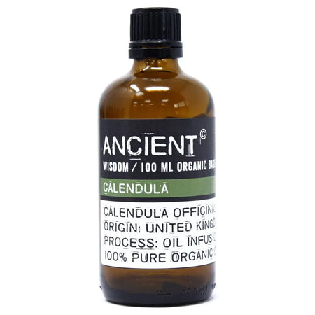 A brown glass bottle with black cap labeled calendula organic base oil 100ml for skin cell regeneration and allergen declarations