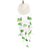 A capiz shell and glass wind chime with green and white sea glass pieces hanging by natural twine