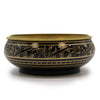 Black and gold carved brass incense jar with intricate animal motifs engraved along the rim