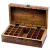 A rustic dark brown carved mango wood aromatherapy box with black metal hinges for essential oils storage