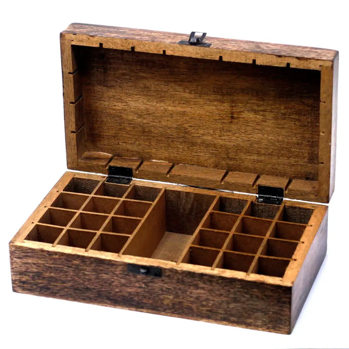 A rustic dark brown carved mango wood aromatherapy box with black metal hinges for essential oils storage