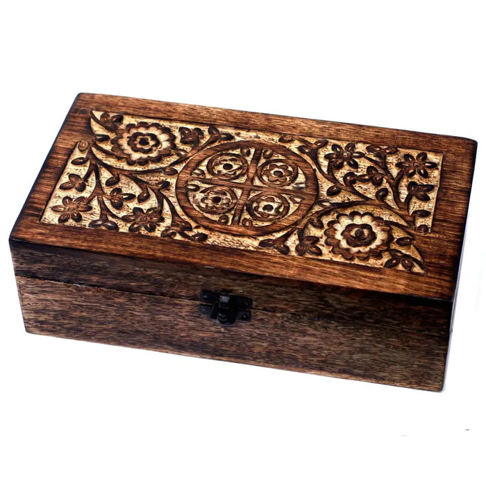 A dark brown carved mango wood aromatherapy box with floral designs and a black metal clasp for essential oils storage