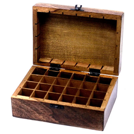 A carved mango wood aromatherapy box with 16 compartments and black metal hinges for essential oils storage