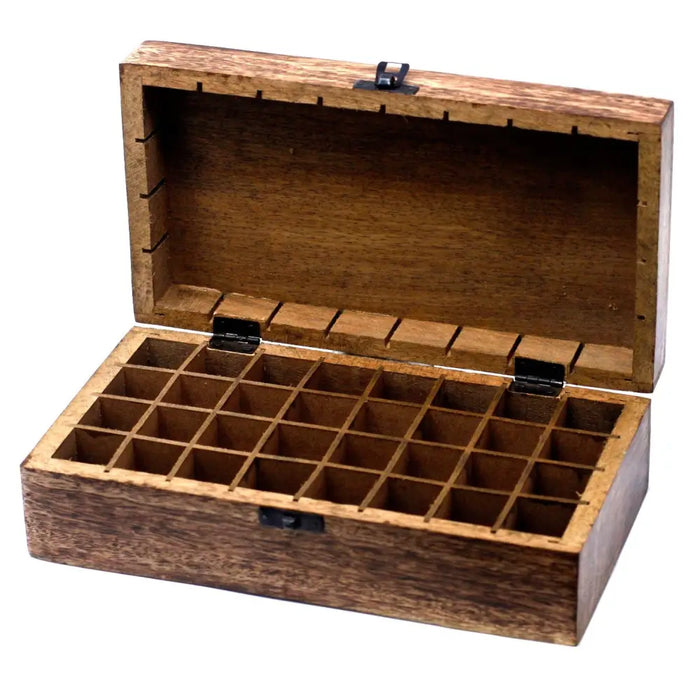 A rustic carved mango wood aromatherapy box with 24 compartments and black metal hinges holds 10ml bottles