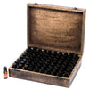 Rustic carved mango wood aromatherapy box holding 48 black capped essential oil bottles in a grid pattern