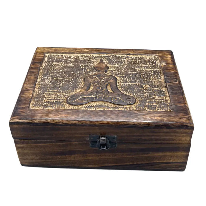 Dark brown mango wood keepsake box with a carved buddha figure in meditative pose and textured patterns on the lid