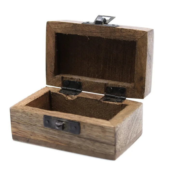 Rustic brown carved mango wood trinket box with black metal hinges and latch in a slavic design