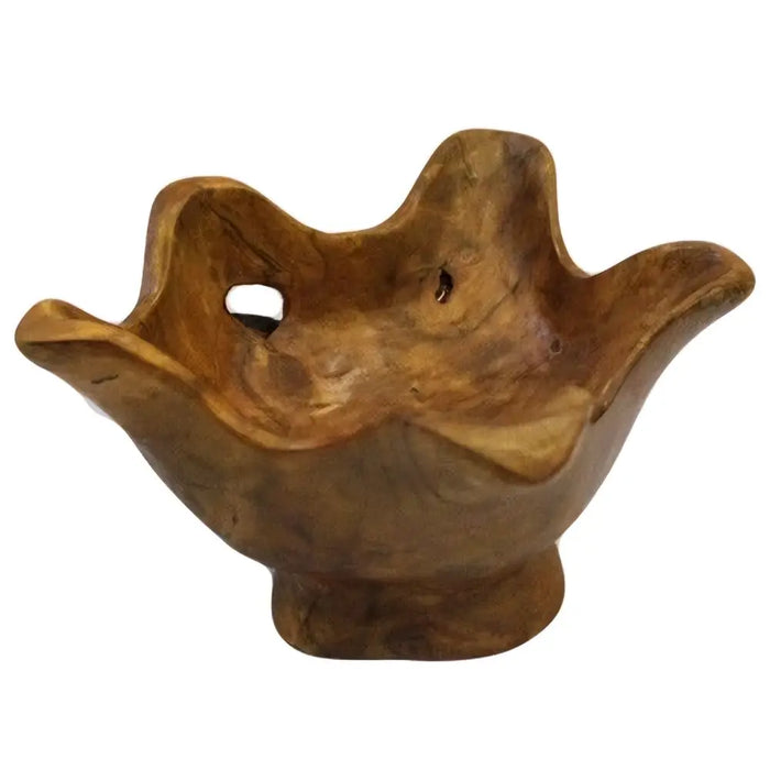 A small round teak root bowl with natural grain patterns and a rustic hand carved leaf shape design