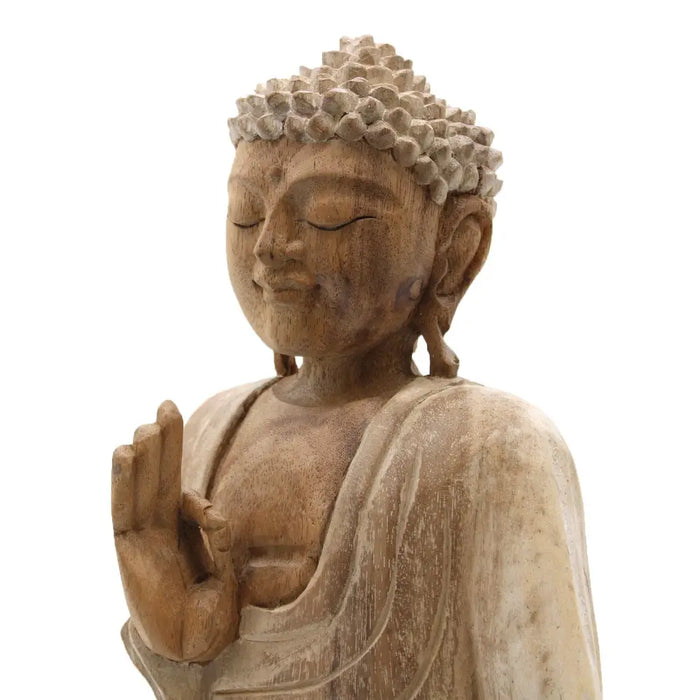 Carved wood buddha statue in natural whitewash suar wood with detailed hair and robes and serene expression 30cm tall