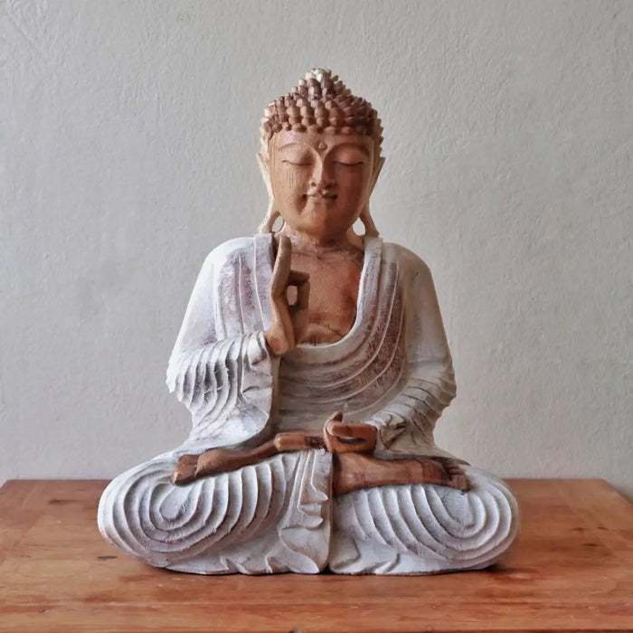 Hand carved suar wood buddha statue with serene expression, whitewashed robes, and ushnisha in natural wood tones, 40cm tall