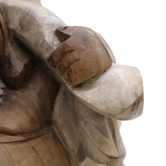 Carved wood happy buddha figure in natural brown suar wood with detailed fingers and textured wood grain whitewash finish