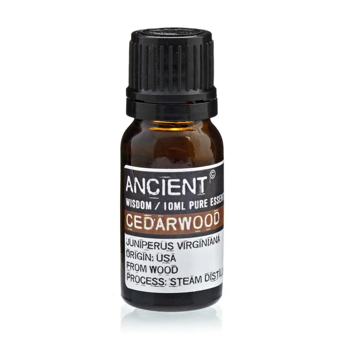 A small amber glass bottle with black cap labeled ancient wisdom cedarwood essential oil 10ml helps sebum production