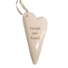 Cream-colored ceramic heart hanging ornament with laugh out loud slogan in soft gray font and satin ribbon loop