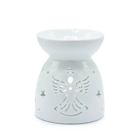 White ceramic oil burner shaped like an angel with star and wing cutouts for holding scented oils
