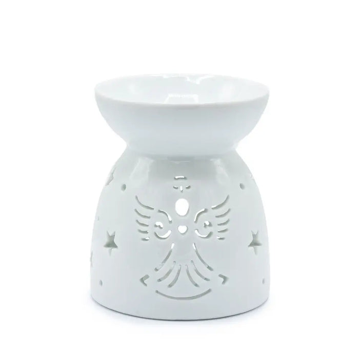 White ceramic oil burner shaped like an angel with star and wing cutouts for holding scented oils