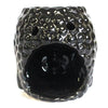 Black ceramic oil burner with textured bumpy surface and two small holes on top for oil burners use