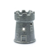 Gray ceramic oil burner shaped like a castle with detailed brickwork and cut out windows for essential oils