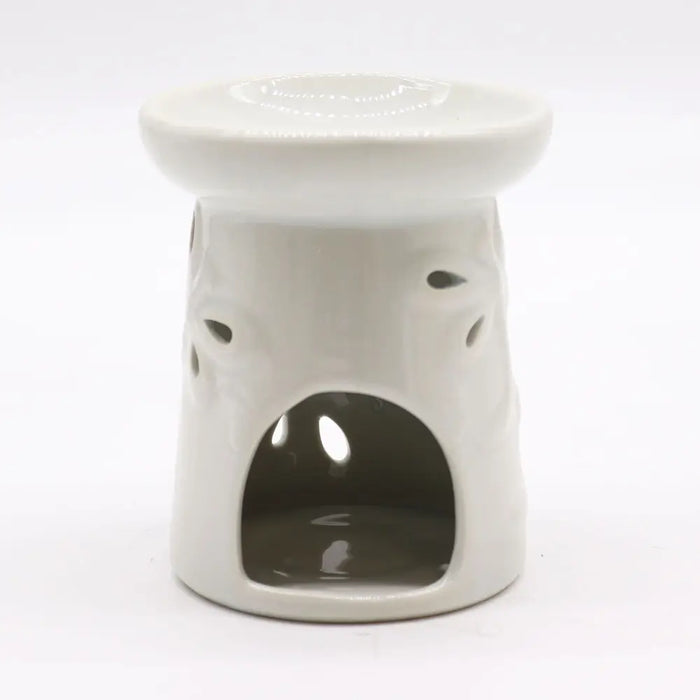 White ceramic oil burner with glossy finish and dragonfly cut-out patterns on the sides for oil burners use