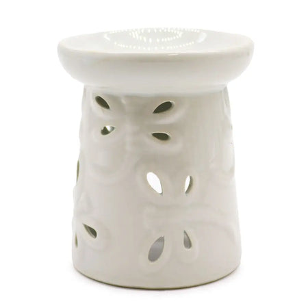 White ceramic oil burner with decorative leaf cutouts designed for use as a ceramic oil burner dragonfly style