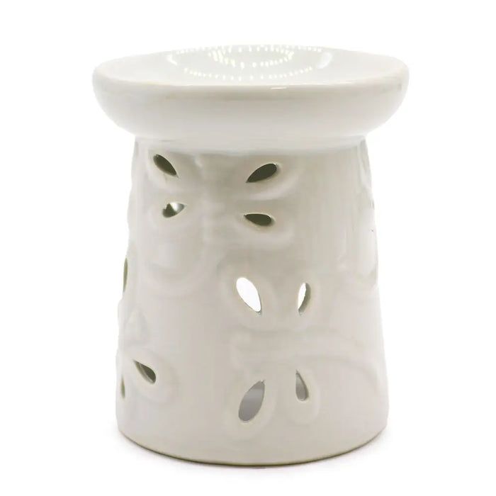 White ceramic oil burner with decorative leaf cutouts designed for use as a ceramic oil burner dragonfly style