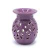Purple ceramic oil burner with leaf pattern cutouts designed for floral lavender scents