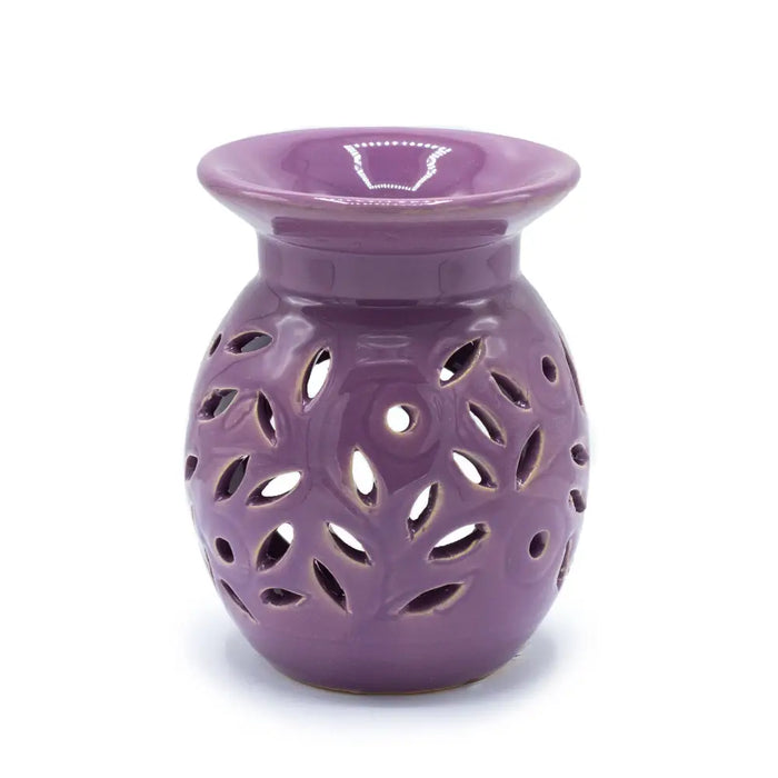 Purple ceramic oil burner with leaf pattern cutouts designed for floral lavender scents