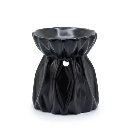 Black ceramic oil burner with a fluted petal top and pleated body for use as an oil burner decoration