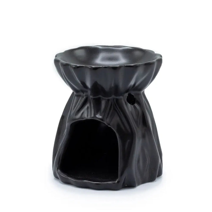 Black ceramic oil burner with fluted petal rim and textured body designed as a geometric oil burner