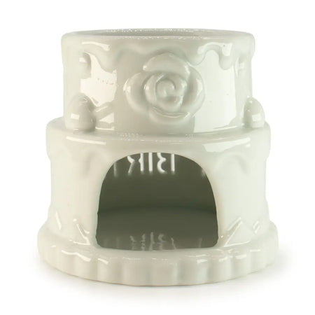 White ceramic oil burner pet heater with a rose design and arched doorway for happy birthday cake decor
