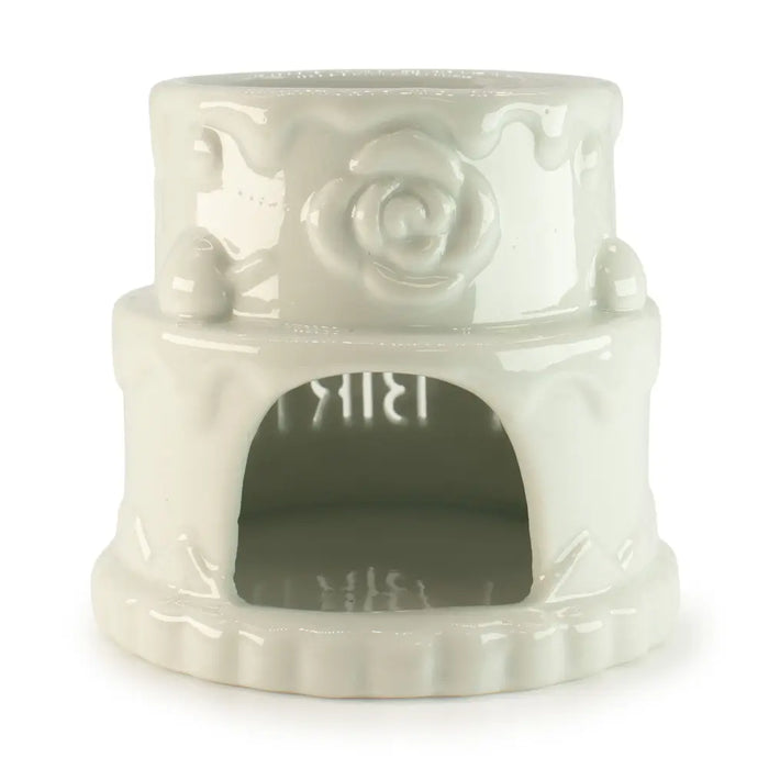 White ceramic oil burner pet heater with a rose design and arched doorway for happy birthday cake decor