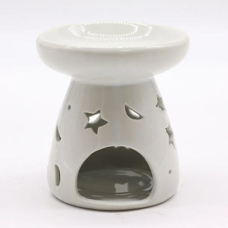 White ceramic oil burner with star-shaped cutouts and glossy finish for use with oil burners in aromatherapy