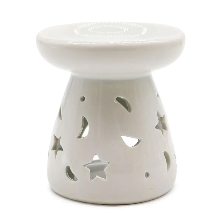 White ceramic oil burner with star and moon cutouts designed for use as an oil burner decoration