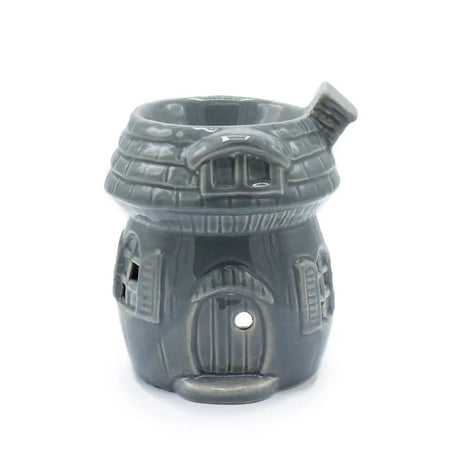 Gray ceramic oil burner shaped like a mushroom house with detailed roof windows and door design