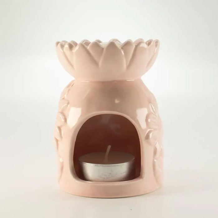 Pink ceramic sunflower oil burner shaped like a lotus with a tealight candle inside its arched opening