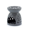 Grey ceramic oil burner with smooth glossy finish and teardrop shaped cutouts along the sides
