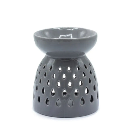 Gray ceramic oil burner with smooth glossy finish and teardrop cutouts along the base for holding oils