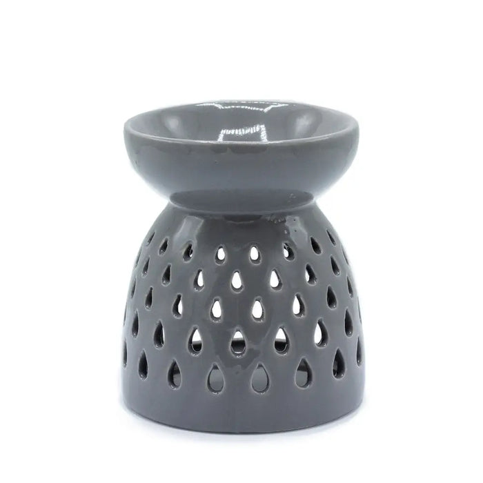 Gray ceramic oil burner with smooth glossy finish and teardrop cutouts along the base for holding oils